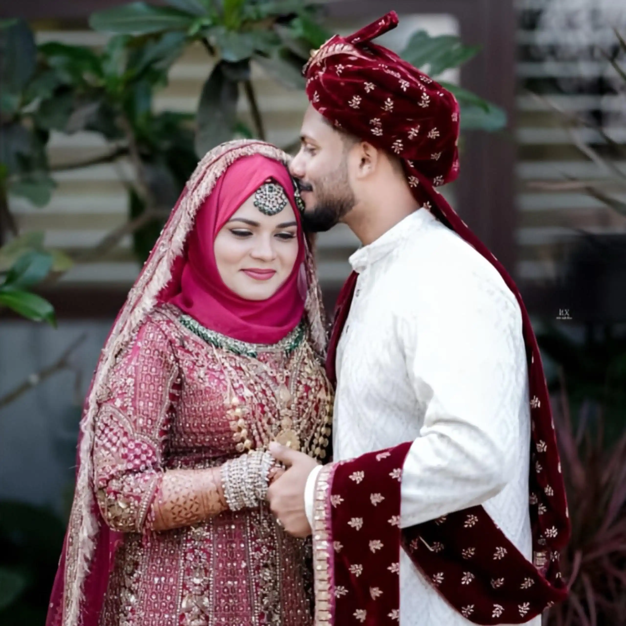 Bride and groom holding hands with hearts full of love, captured romantically by the best wedding photographer in Malappuram.