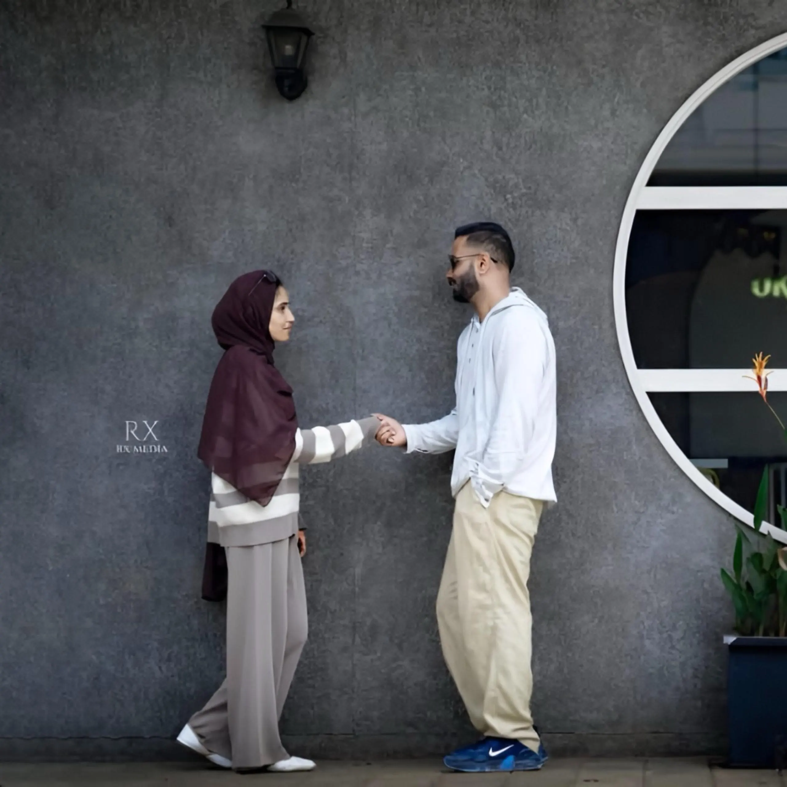 Bride and groom holding hands in a romantic save-the-date pose, captured by the best wedding photographer in Malappuram