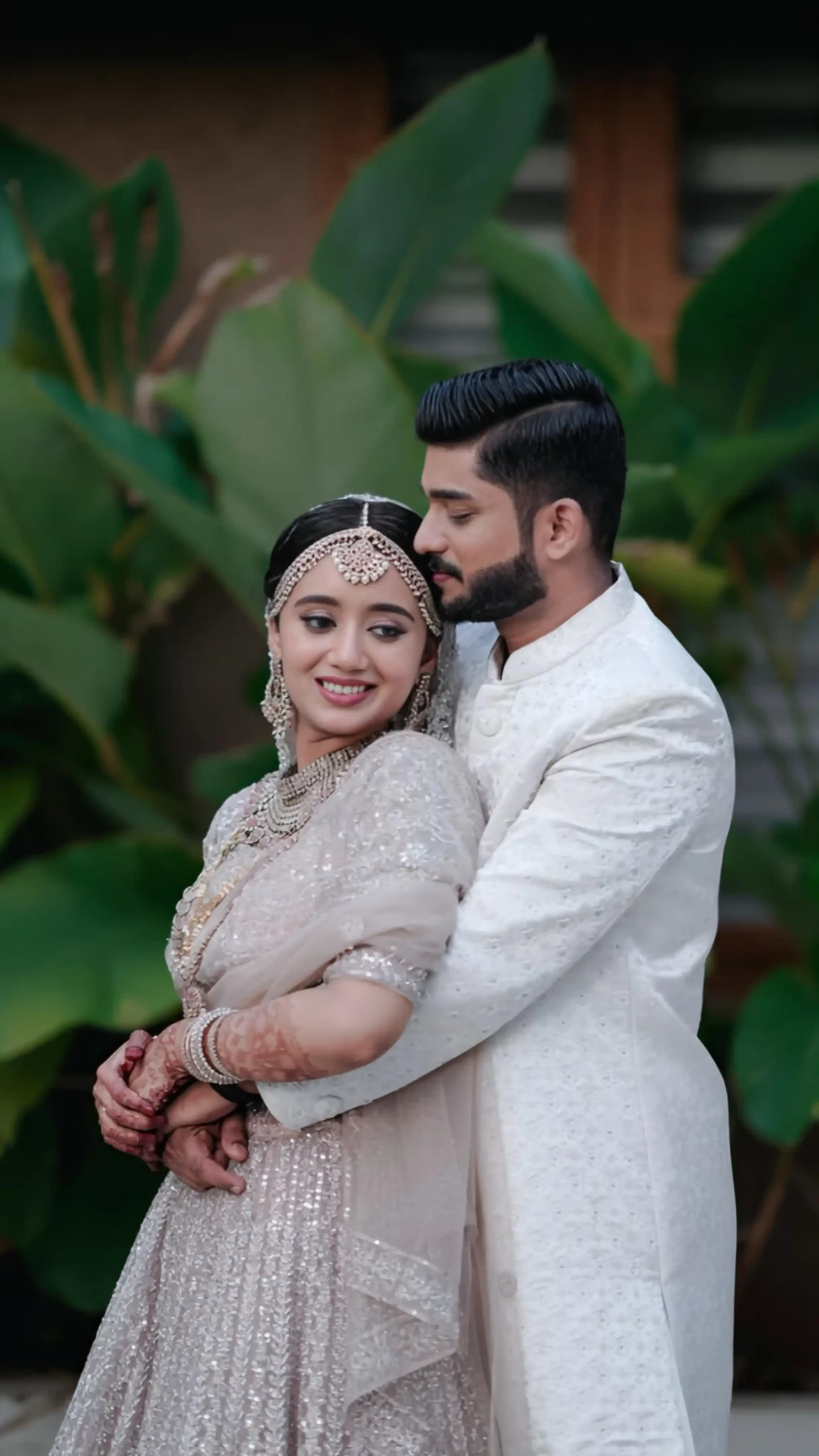 Romantic wedding moment of the bride and groom hugging, captured by the best wedding photographer in Malappuram