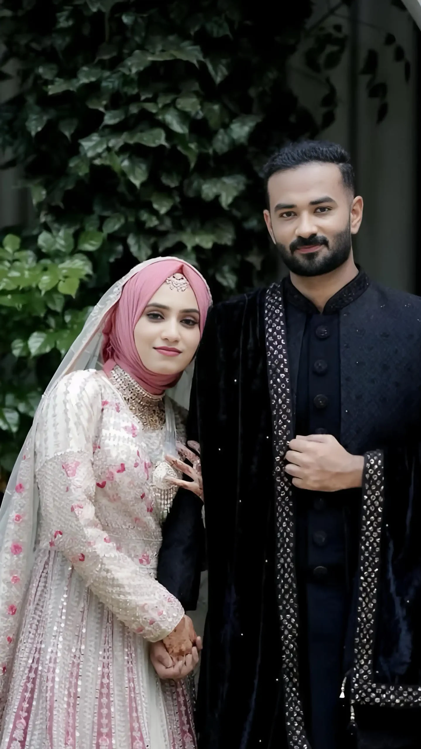 Bride and groom holding hands in a wedding moment, captured by the best wedding photographer in Malappuram
