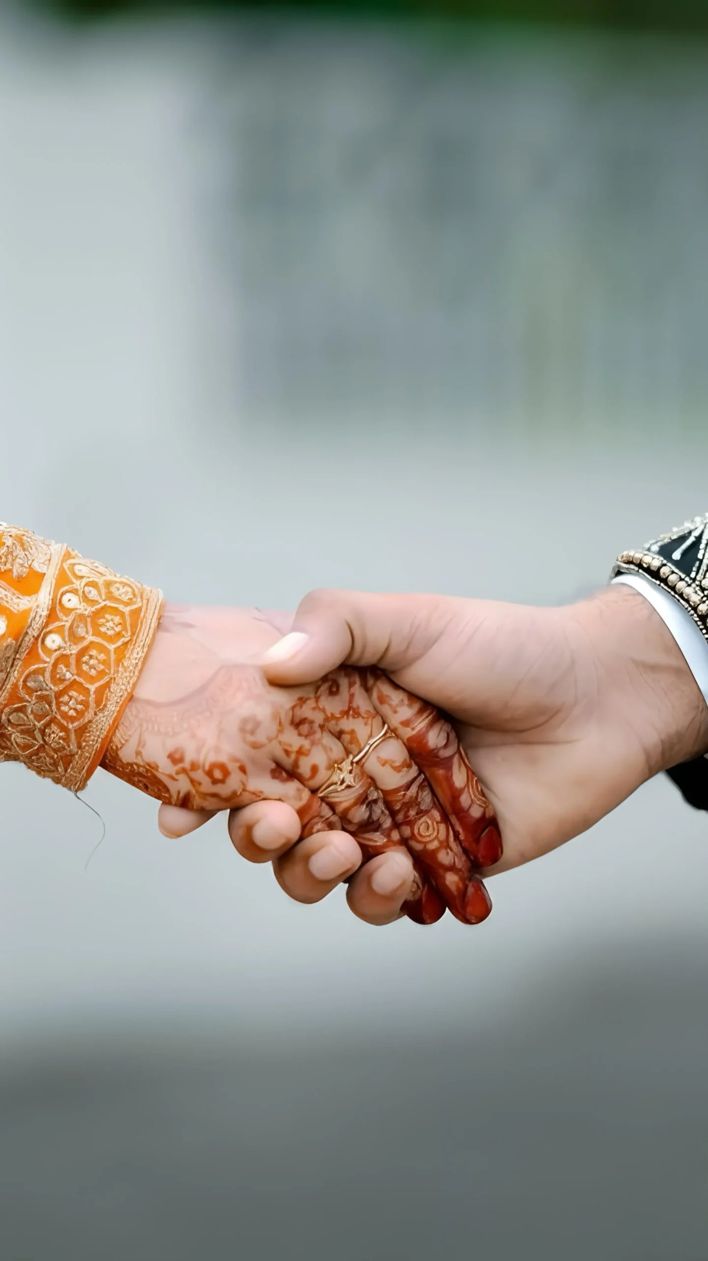 Bride and groom hand in hand wedding moment, captured by the best wedding photographer in Malappuram
