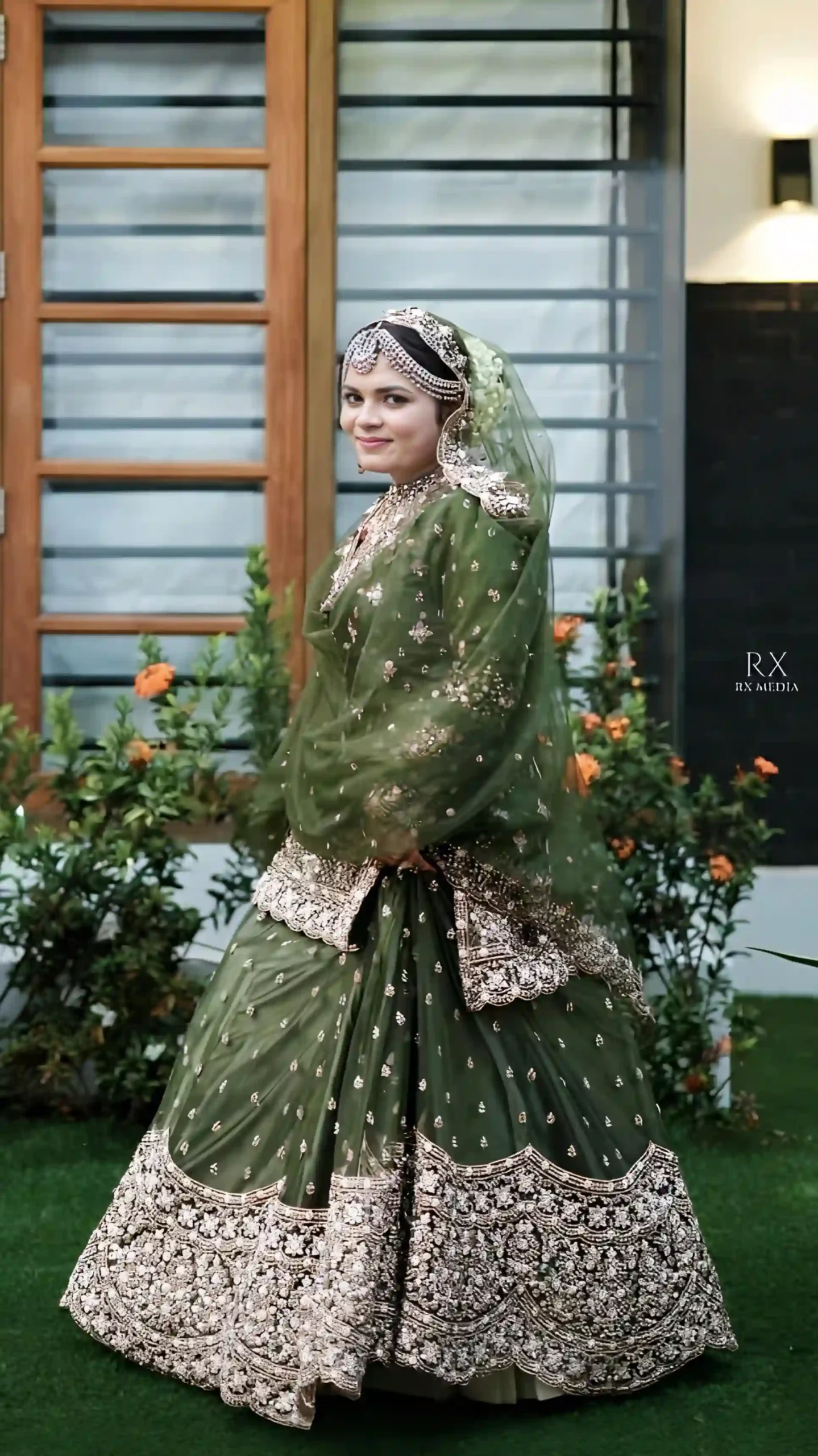 Bride in a beautiful green lehenga on her Mehendi day, captured by the best wedding photographer in Malappuram